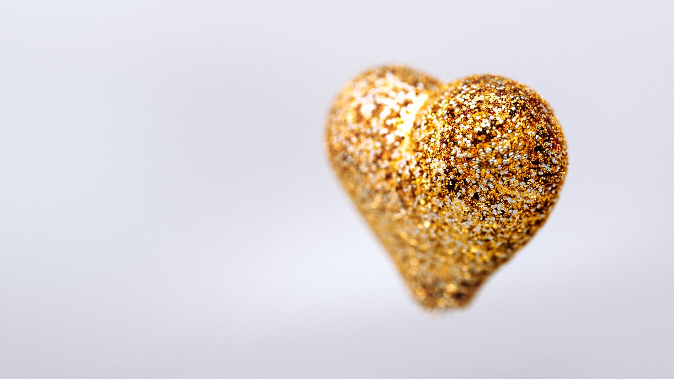 Heart made of gold INGUN test probes on a grey background